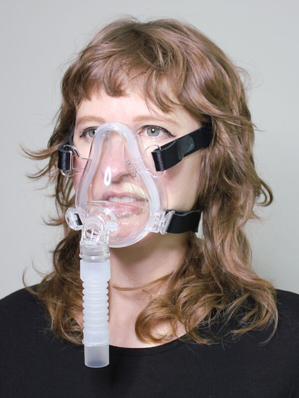 Photo of Sunset Deluxe Full Face CPAP mask in use (on female model)