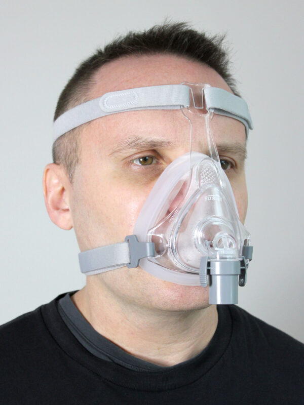 A man wearing the Sol Full Face CPAP Mask