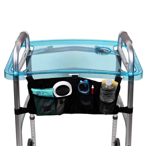 Photograph of a clear acrylic tray fit over the handles of an aluminum assistive walker