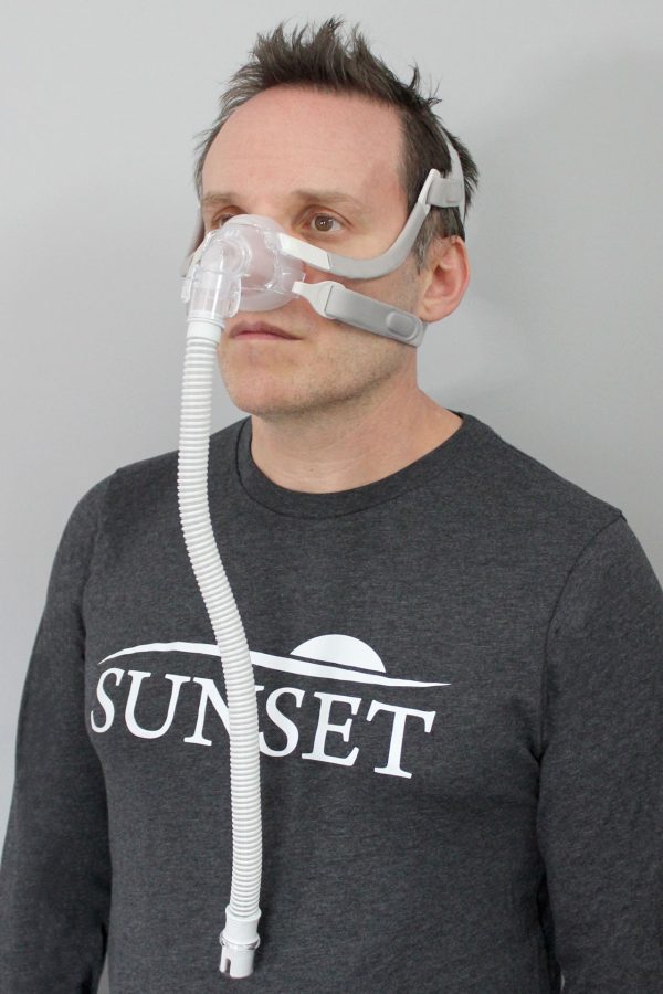 A man wearing the Sunset Vesper Nasal CPAP Mask
