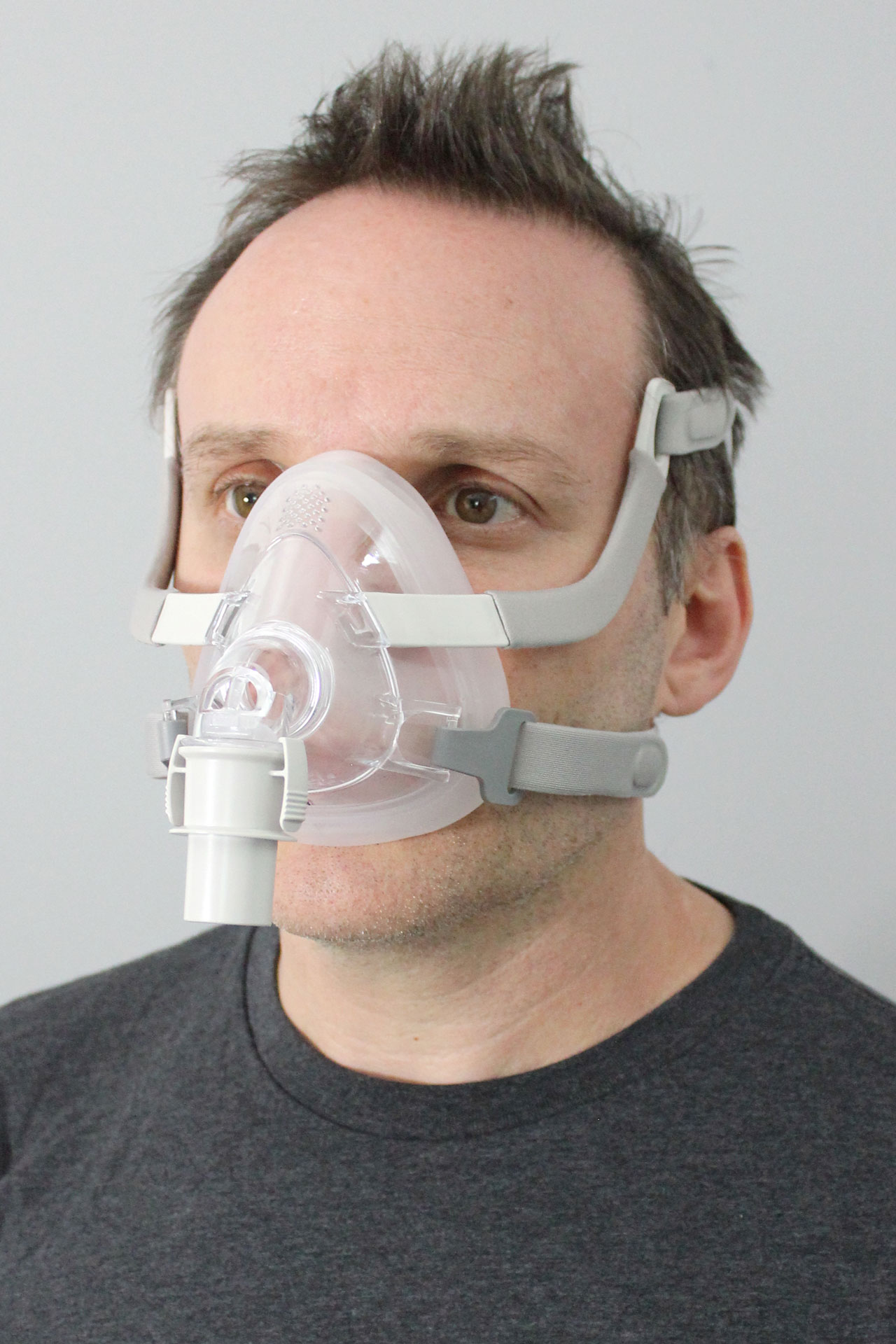 A man wearing the Sunset Vesper Full Face CPAP Mask